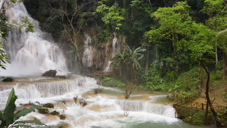 Tourists-Taking-Photos-Overlooking-Cascading-Kuang-Si-Waterfalls-At-Luang-Prabang