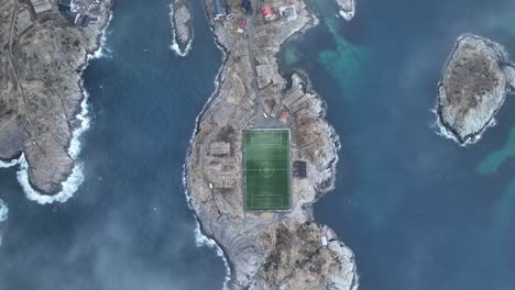 Aerial-view-of-Henningsvaer-football-field-on-Lofoten-Islands,-Norway