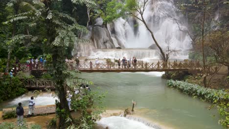 Tourists-Taking-Photos-From-Bridge-Of-Cascading-Kuang-Si-Waterfalls-At-Luang-Prabang