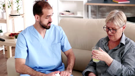 Elderly-retired-woman-in-nursing-home-with-male-doctor