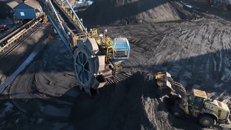 Bucket-wheel-excavator-and-CAT-wheel-loader-at-a-lignite-coal-distribution-port-and-mine