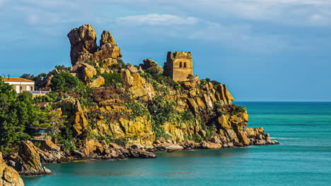 Castle-tower-ruins-on-rocky-coastline-of-Sicily,-time-lapse-view