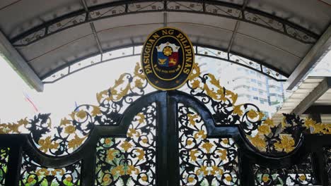 Gate-at-the-Philippine-Embassy-with-the-national-seal-on-the-top,-Sukhumvit-Road-corner-Soi-Philippines-Soi-30,1,-Bangkok,-Thailand