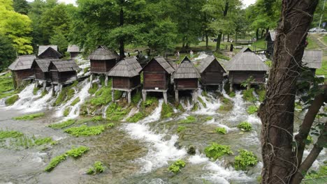 Historic-Watermills-on-Jajce's-River,-Aerial-in-Bosnia-and-Herzegovina
