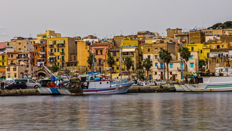 Beautiful-coastal-city-with-moored-boats-in-Sicily,-time-lapse-view