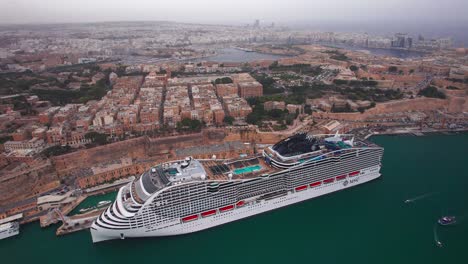 Aerial-Orbit-Around-Huge-Cruise-Ship-in-Valletta,-Malta