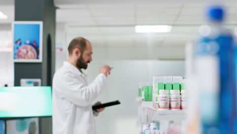 Medical-worker-counting-medicaments-boxes-placed-on-shelves