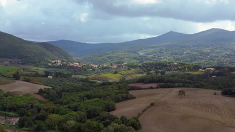 Lovely-aerial-top-view-flight-Tuscany-meditative-valley,-village-Italy-fall-23