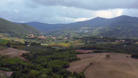 Amazing-aerial-top-view-flight-Tuscany-meditative-valley,-village-Italy-fall-23