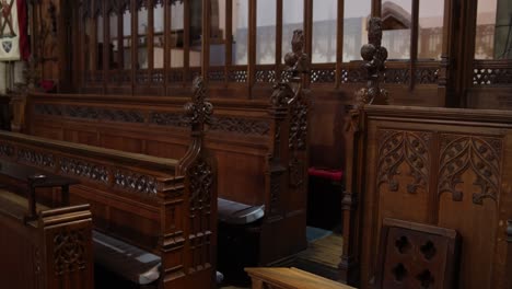 old-wooden-church-pews-along-the-interior-of-european-cathedral-in-Inverness,-Scotland-in-the-Highlands