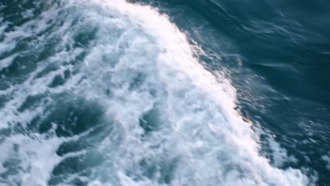 Slow-motion-view-of-the-wave-beside-a-ship-at-sea-from-high-angle-view