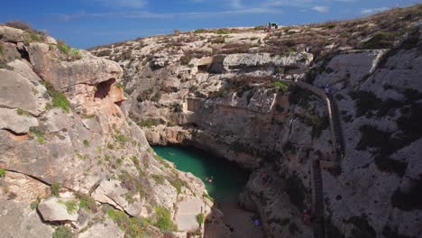 Aerial-Drone-Through-Gozo-Canyon,-Wied-il-Ghasri,-Malta
