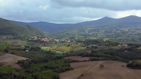 Dramatic-aerial-top-view-flight-Tuscany-meditative-valley,-village-Italy-fall-23