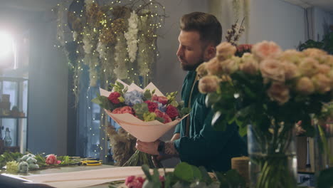 Florist-Collects-Bouquet-and-Looks-at-Camera