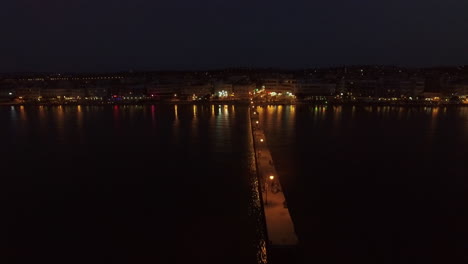 Aerial-night-view-of-resort-and-pier-in-the-sea