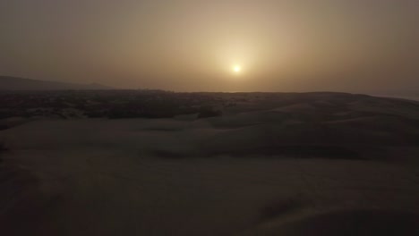 Aerial-scene-of-sand-dunes-at-sunset