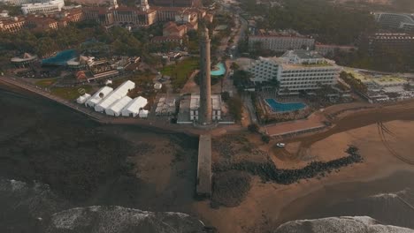 Aerial-scene-of-Gran-Canaria-tourist-town-with-Maspalomas-Lighthouse