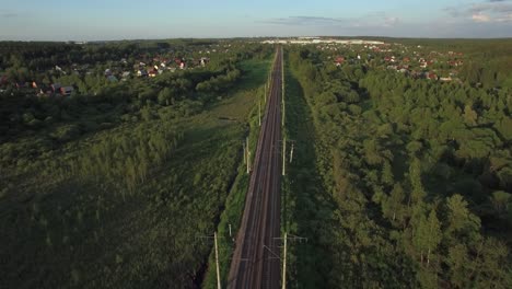 Aerial-shot-of-railway-running-through-the-village-Russia