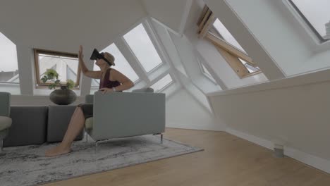 Woman-entertaining-with-VR-headset-in-Cube-House