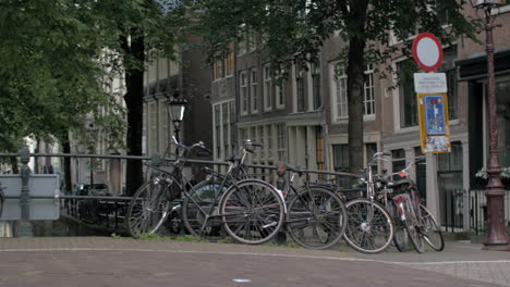Bicycles-parked-on-the-bridge-in-Amsterdam