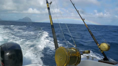 Fishing-rods-on-sailing-motor-boat