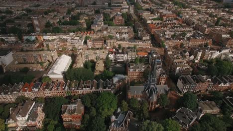 Aerial-shot-of-Amsterdam-with-houses-and-Volden-Church