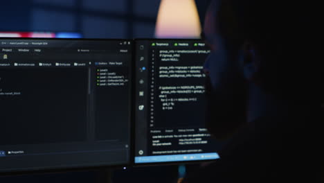 Software-engineer-writes-complex-binary-code-scripts-on-computer