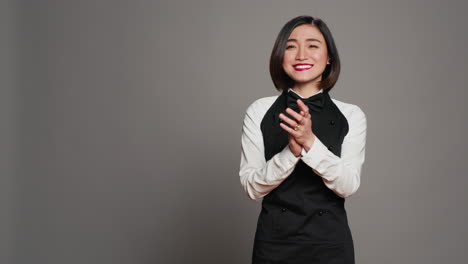 Restaurant-hostess-clapping-hands-and-celebrating-for-someone,