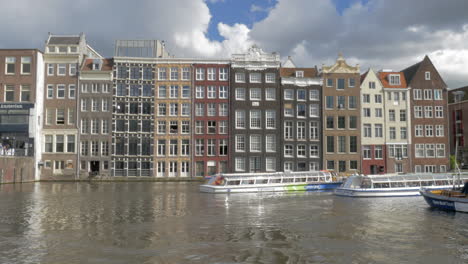 Timelapse-of-touristic-water-buses-on-Amsterdam-canal