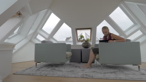 Woman-with-pad-in-the-room-of-Cube-House