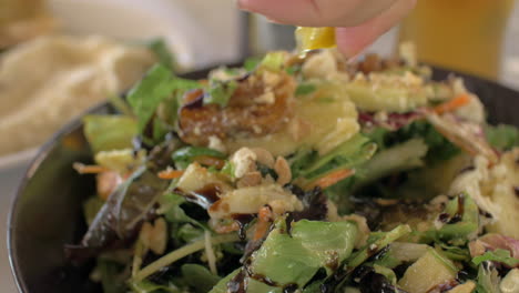 Eating-mixed-green-salad