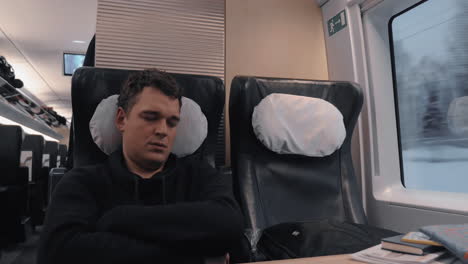 Sleeping-man-in-express-train