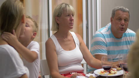 Lively-conversation-at-family-dinner