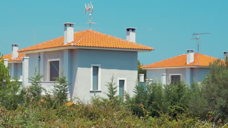 Grey-houses-with-red-roofs