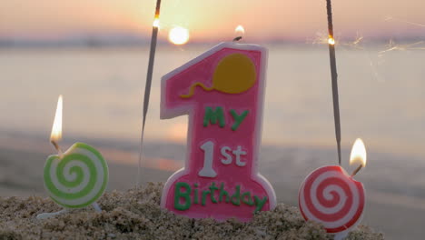 Baby-girl-first-birthday-candle-on-the-beach