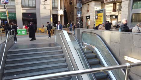 People-Walk-Around-Barcelona-Gothic-Underground-Metro,-Escalator-Moving-Staircase