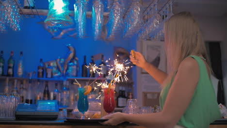 Waitress-carrying-cocktails-with-sparklers