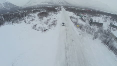 Aerial-shot-of-car-arriving-to-the-hotel-parking