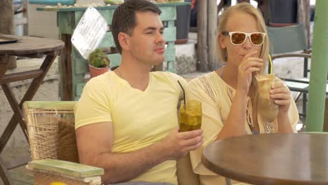 Couple-Drinking-Ice-Coffee-and-Talking