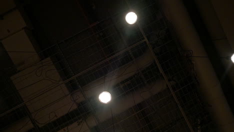View-to-the-dark-ceiling-with-hanging-lamps