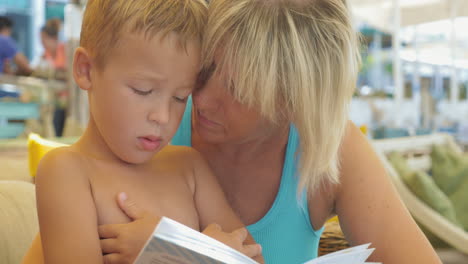 Mature-Woman-Reading-a-Book-to-Boy