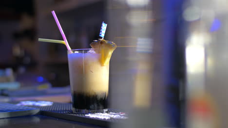 Barman-Putting-Straws-into-Glass-with-Cocktail