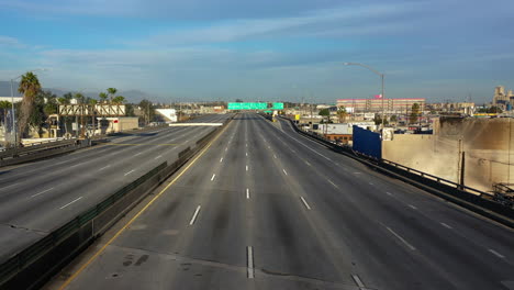 Drone-shot-approaching-freeway-signs-at-the-closed-Interstate-10-in-Los-Angeles