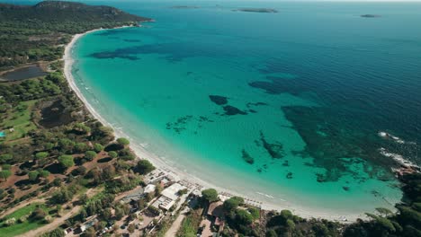 aerial,-droneshot-of-a-long-empty-beach-with-turquoise-water,-Corsica,-France
