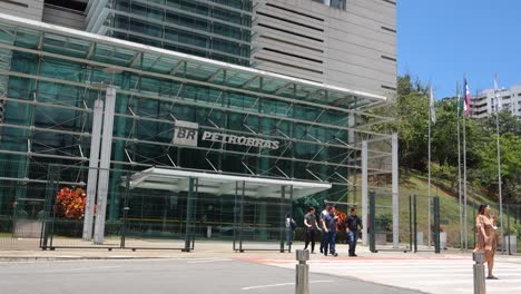 people-walk-in-front-of-Petrobras-headquarter-building-in-Vitoria,-Espirito-Santo,-BR