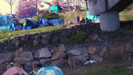 Homeless-people-in-tents-set-up-under-a-bridge-on-a-major-thorofare-in-Portland-Maine