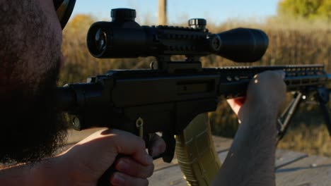 man-firing-a-shot-with-an-WK181c-gun-at-a-shooting-range,-golden-mag,-Canadian-WK181c,-close-up-recoil