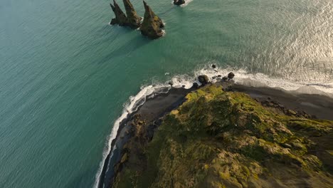 Aerial-FPV-diving-shot-down-a-cliff-towards-the-Reynisdrangar-basalt-sea-stacks