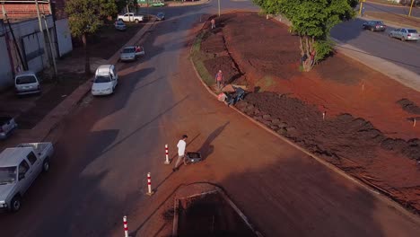 Construction-workers-working,-Workers-planting-trees-in-the-sidewalk,-cleaning-street