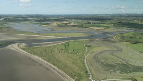 Scenic-Aerial-Of-Pilmore-Strand-And-St-Ita's-GAA-Pitch-Club-Near-Youghal-In-County-Cork,-Ireland